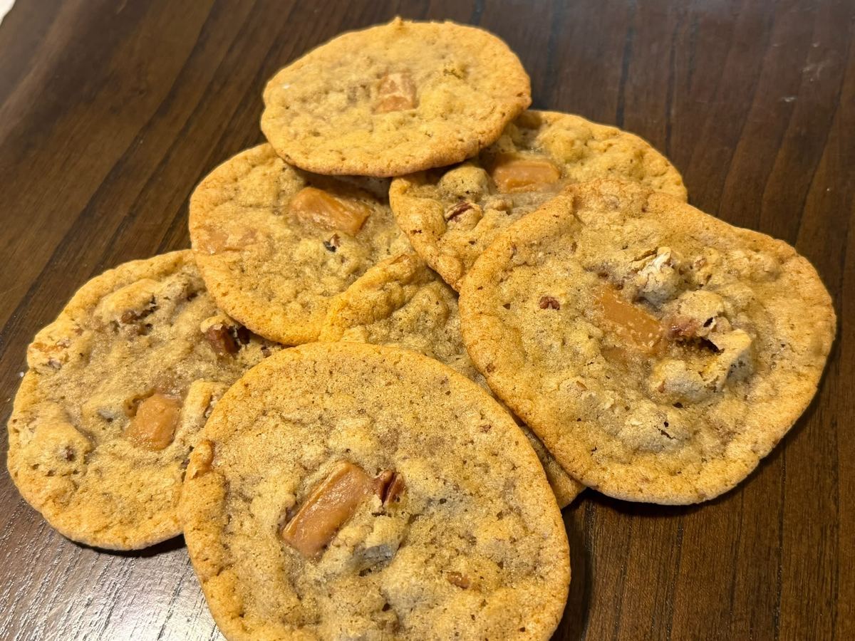 Maple fudge and pecan cookies on a wooden table